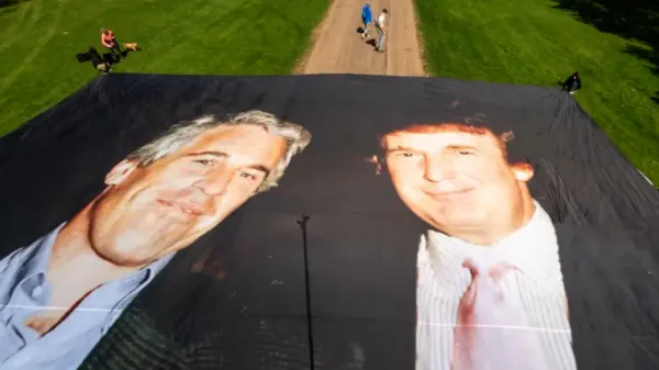 A massive photo of Jeffrey Epstein and Donald Trump unfurled by protestors outside of Windsor Castle during Trump's visit in September 2025.